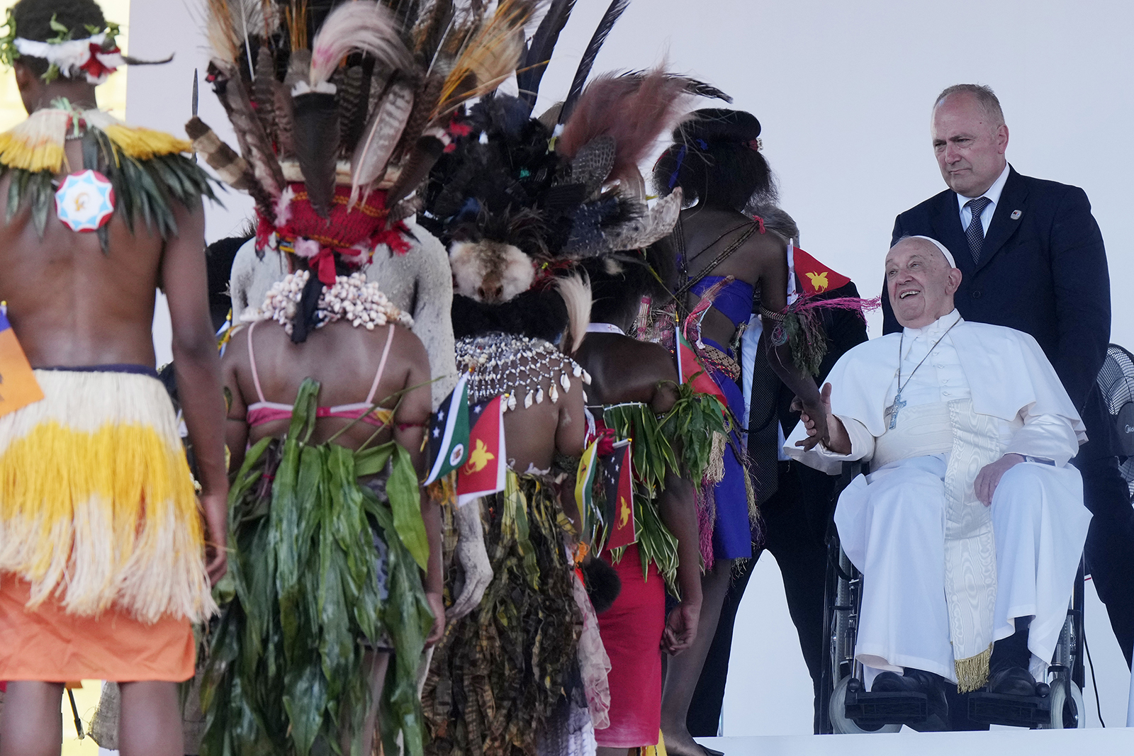 Pope Francis greets people in traditional dress while meeting young people in the Sir John Guise Stadium in Port Moresby, Papua New Guinea, Sept. 9, 2024. (AP Photo/Mark Baker)